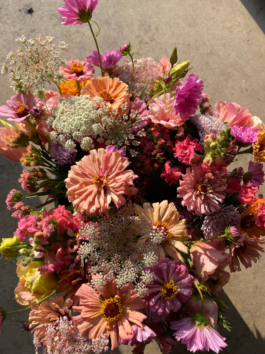 Mixed bouquets of pink, peach, and purple flowers grown on the Lily Stone Gardens flower farm.