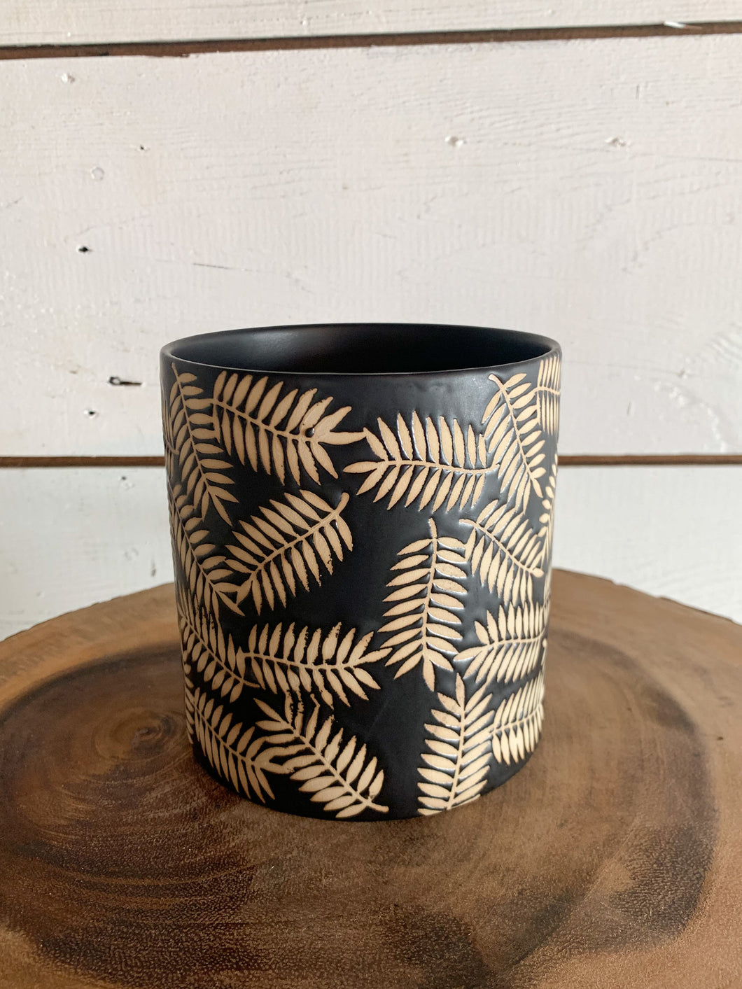 Black pot with leaf imprints