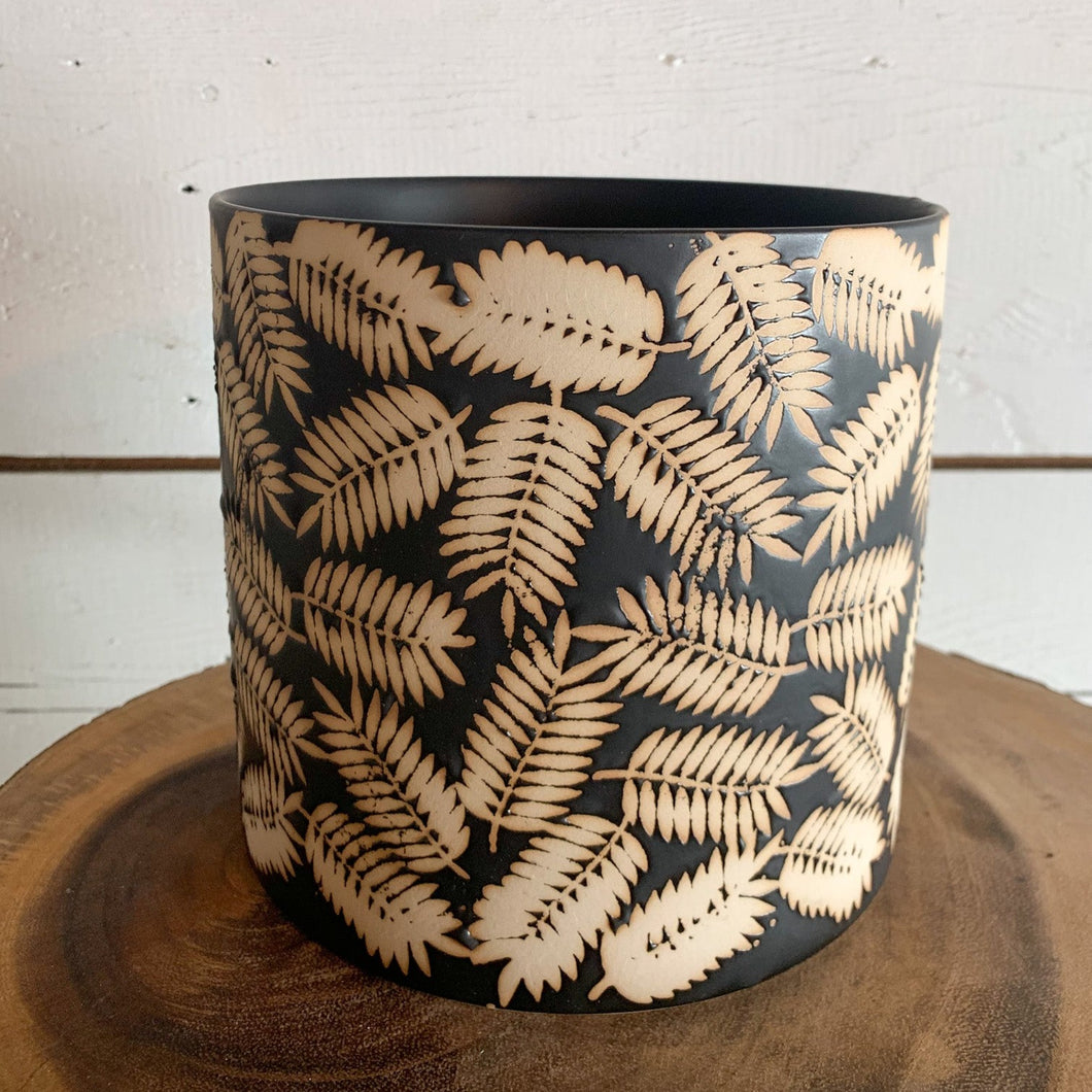 Black pot with leaf imprints